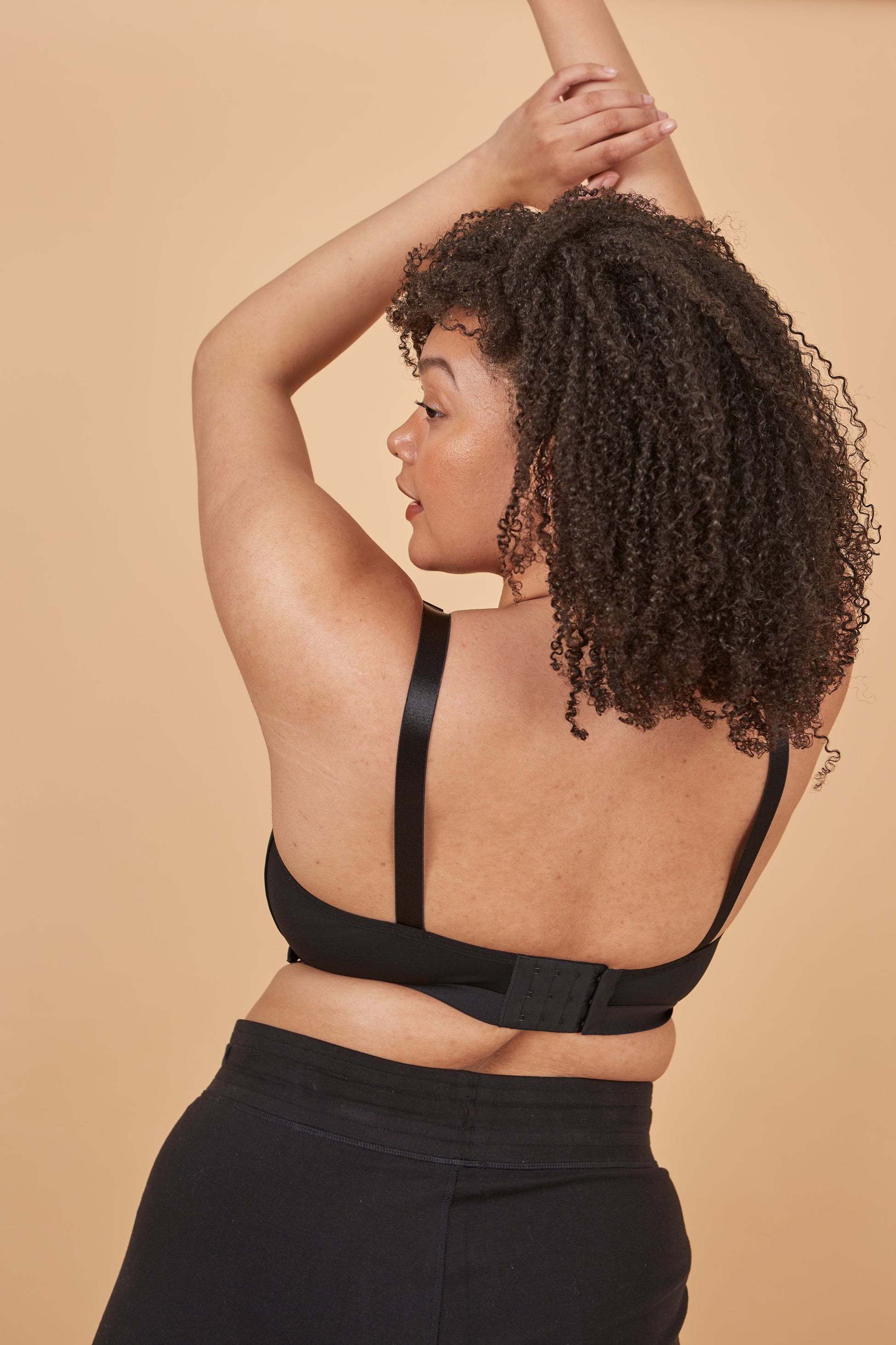 Easy-On Mobility Bra | Springrose® woman wearing black bra with back turned from AskSAMIE