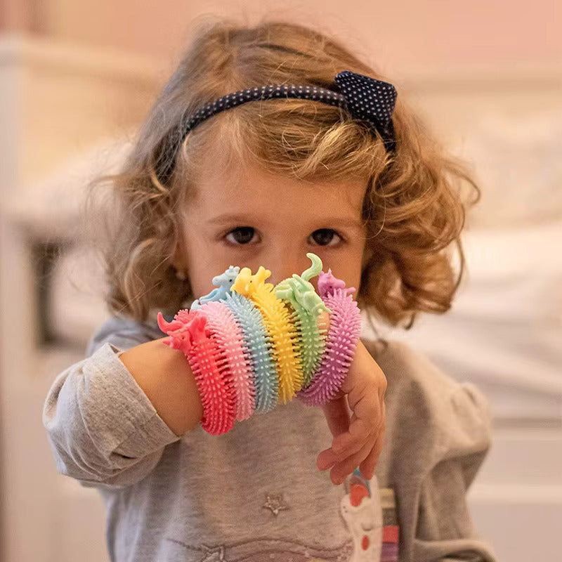 girl playing with stretchy strings as bracelets from AskSAMIE