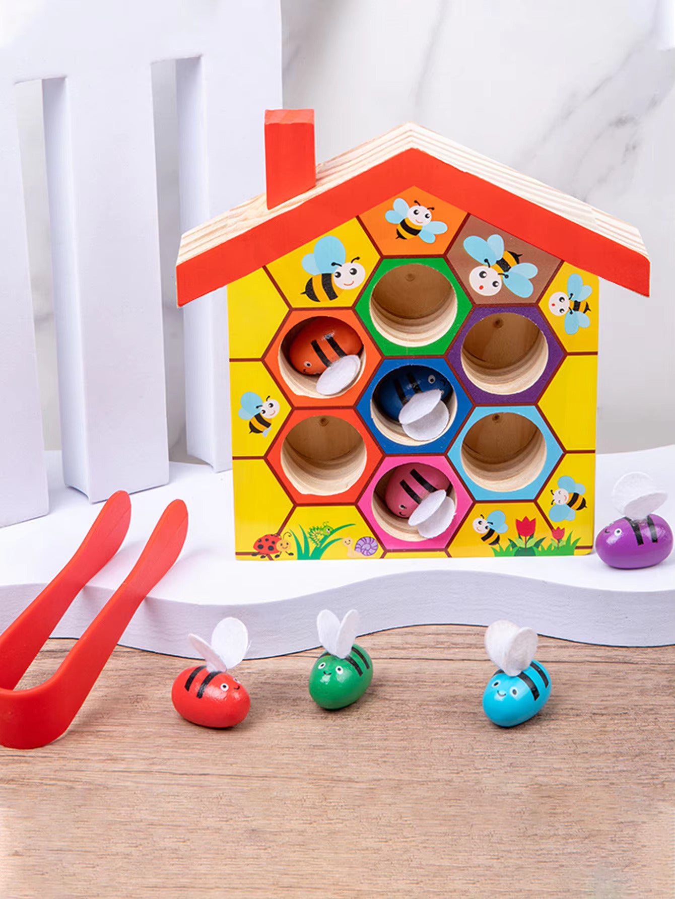 Beehive Matching Game with toy bees and tweezers from AskSAMIE