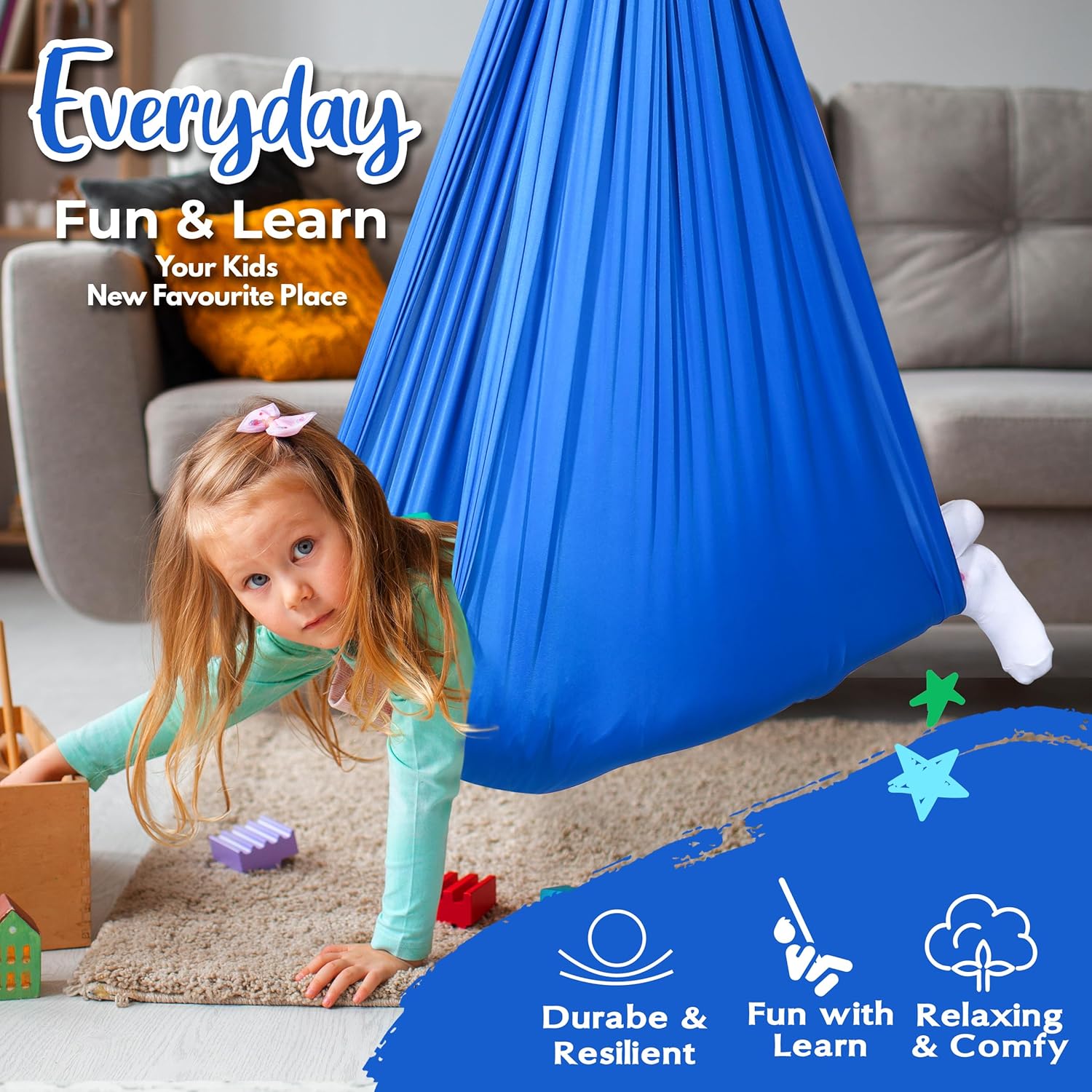 Child swinging in Sensory Swing while playing with toys from AskSAMIE