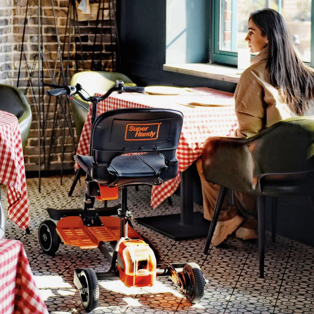 Foldable Mobility Scooter inside restaurant beside woman owner by AskSAMIE